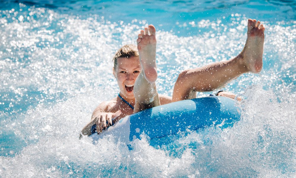 Lady in Blue Tube in Pool