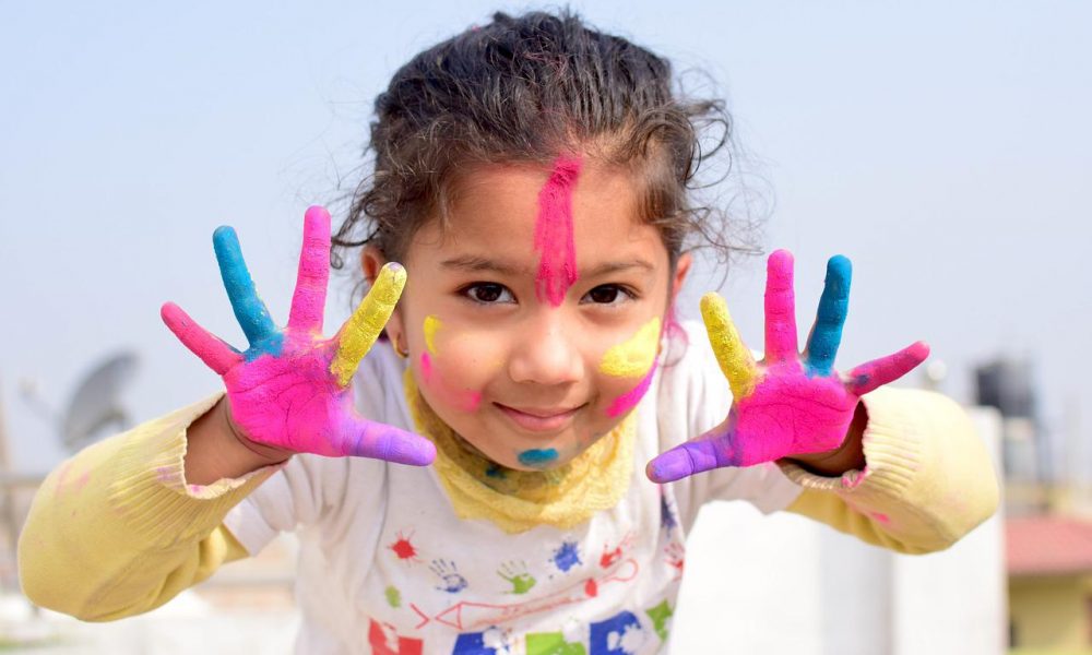 Little Girl with Face and Hand Paint