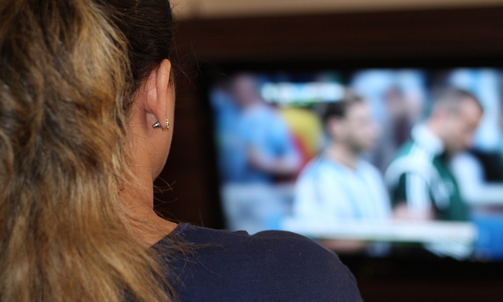 Women Watching TV at the Bar